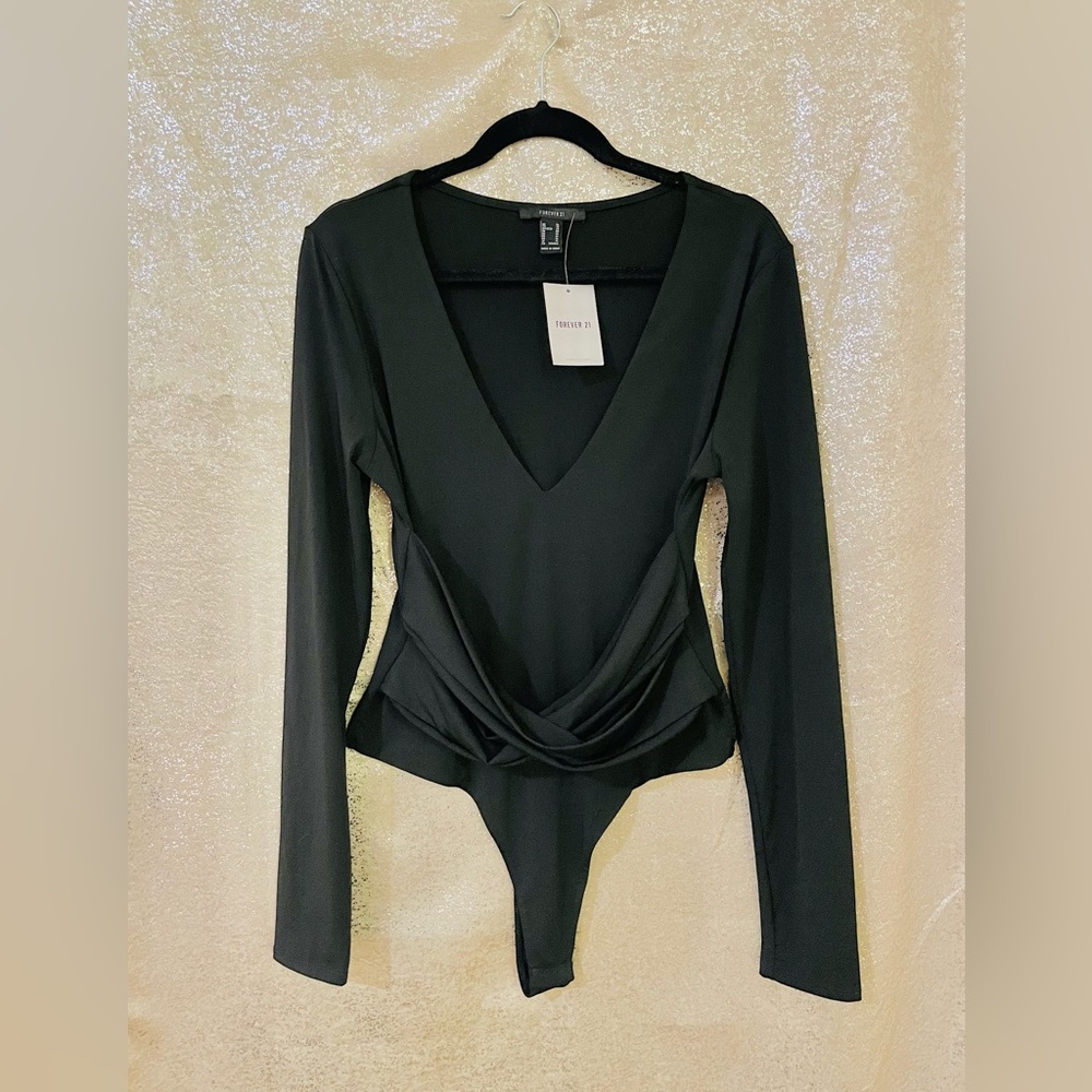 Body suit color black, size XL. NWT